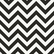 FEZ Noir by Schumacher, a bold black and white chevron stripe wallpaper designed by Martyn Lawrence Bullard, shown in a modern bathroom interior.