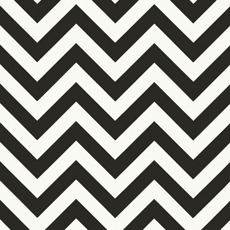 FEZ Noir by Schumacher, a bold black and white chevron stripe wallpaper designed by Martyn Lawrence Bullard, shown in a modern bathroom interior.
