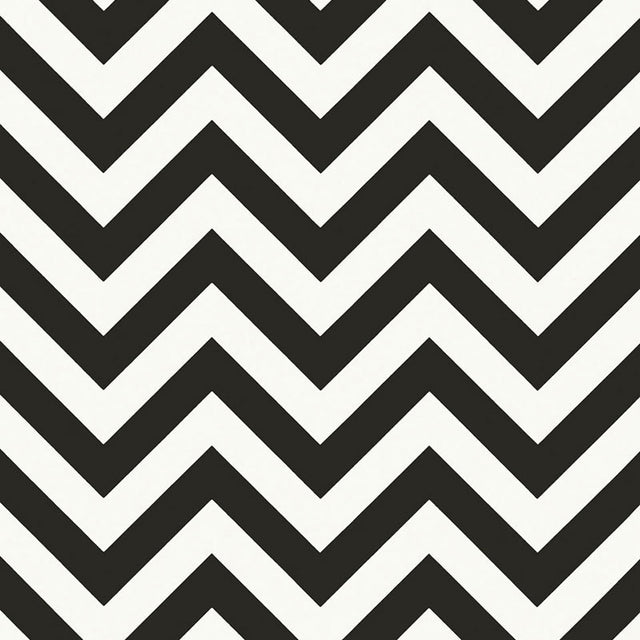 FEZ Noir by Schumacher, a bold black and white chevron stripe wallpaper designed by Martyn Lawrence Bullard, shown in a modern bathroom interior.