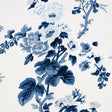 Pyne Hollyhock Indigo by Schumacher - a hand-screened floral chintz wallpaper in blue and white, shown in various interior settings.