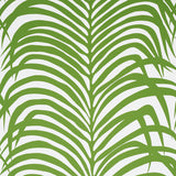 Zebra Palm Jungle wallpaper by Schumacher featuring bold green palm fronds on a white background, shown in various interior settings.