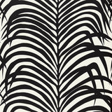 Zebra Palm Ebony wallpaper by Schumacher featuring bold black palm leaf silhouettes on a white background.
