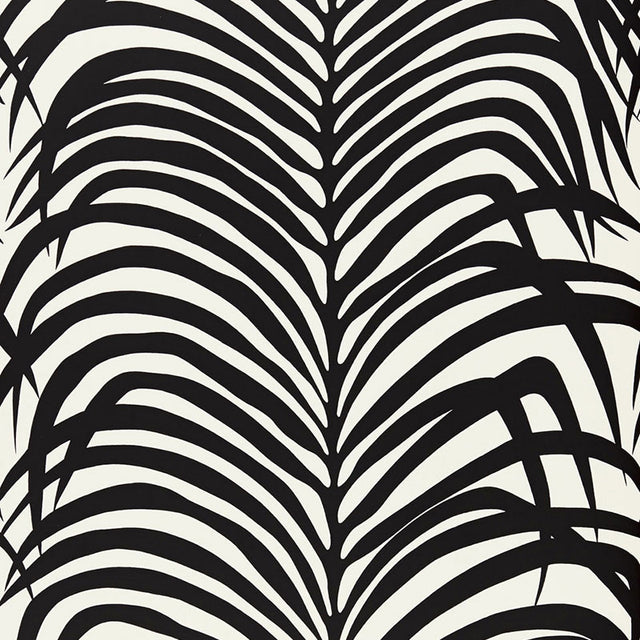 Zebra Palm Ebony wallpaper by Schumacher featuring bold black palm leaf silhouettes on a white background.