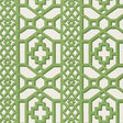 Zanzibar Trellis Jade geometric trellis wallpaper by Schumacher shown in a modern entryway with white paneling and green accents.