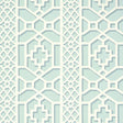 Zanzibar Trellis Winter Mint wallpaper by Schumacher in a geometric trellis pattern, shown in a styled interior setting.