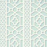 Zanzibar Trellis Winter Mint wallpaper by Schumacher in a geometric trellis pattern, shown in a styled interior setting.