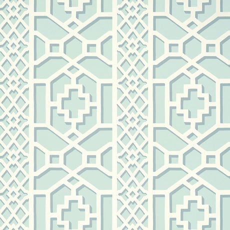 Zanzibar Trellis Winter Mint wallpaper by Schumacher in a geometric trellis pattern, shown in a styled interior setting.