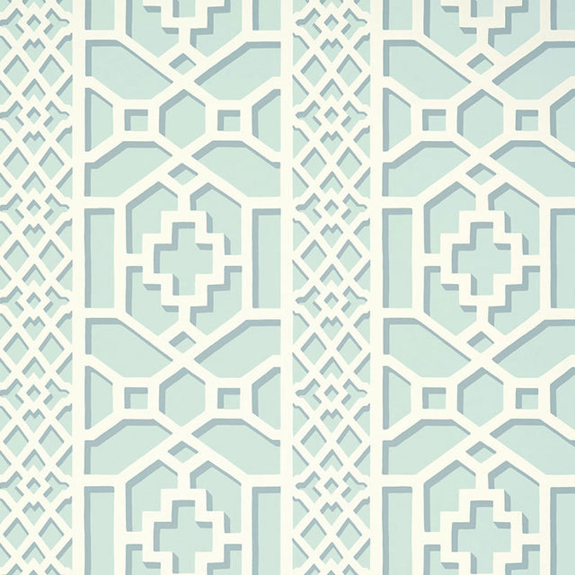 Zanzibar Trellis Winter Mint wallpaper by Schumacher in a geometric trellis pattern, shown in a styled interior setting.