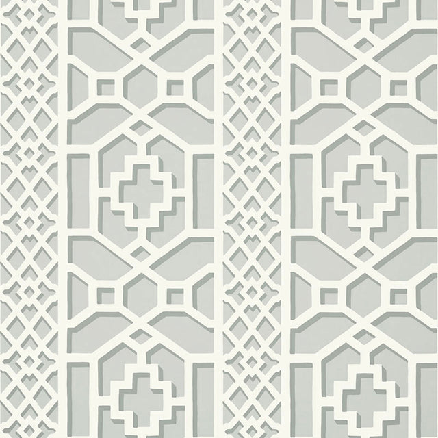 Zanzibar Trellis wallpaper in Cloud by Schumacher features a geometric fretwork trellis pattern inspired by Elsie de Wolfe, shown in soft neutral tones.