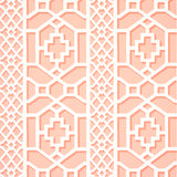 Zanzibar Trellis wallpaper in coral by Schumacher, featuring a bold geometric fretwork pattern inspired by Elsie de Wolfe's trellised rooms.