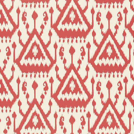 Vientiane Ikat wallpaper in coral by Schumacher, featuring a bold geometric ikat pattern.