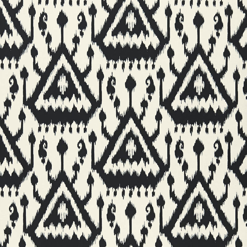 Vientiane Ikat Ebony by Schumacher - black and white geometric ikat wallpaper in a modern interior setting