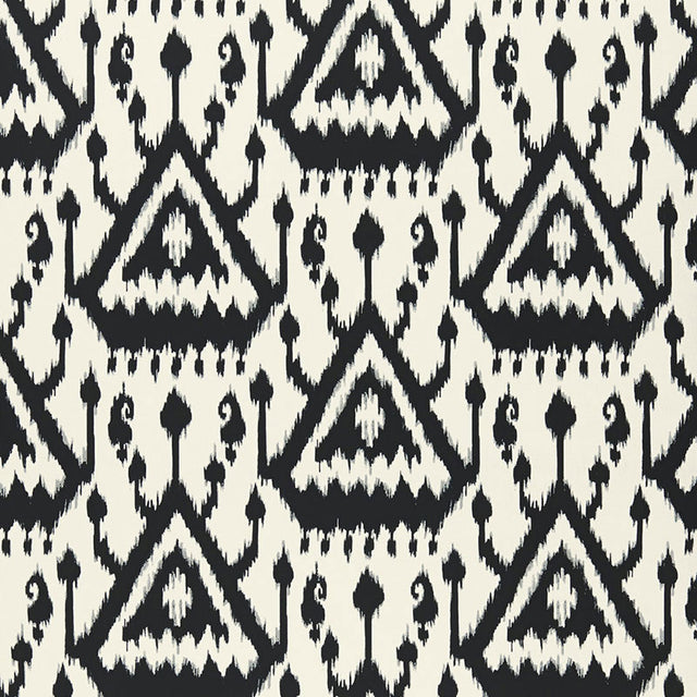 Vientiane Ikat Ebony by Schumacher - black and white geometric ikat wallpaper in a modern interior setting