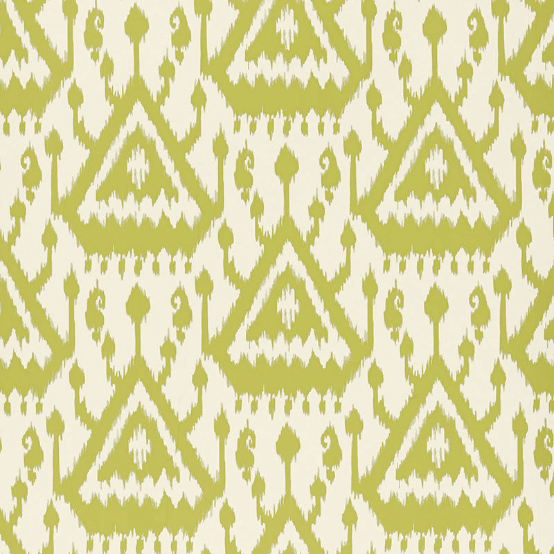 Vientiane Ikat wallpaper in Palm colorway by Schumacher, featuring a bold geometric ikat pattern in green and white.