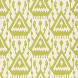 Vientiane Ikat wallpaper in Palm colorway by Schumacher, featuring a bold geometric ikat pattern in green and white.