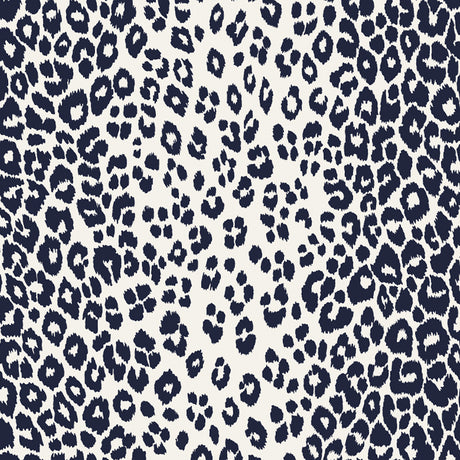 Iconic Leopard Ink wallpaper by Schumacher featuring a bold animal print pattern in deep blue and white.