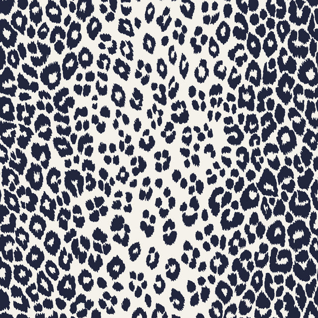 Iconic Leopard Ink wallpaper by Schumacher featuring a bold animal print pattern in deep blue and white.