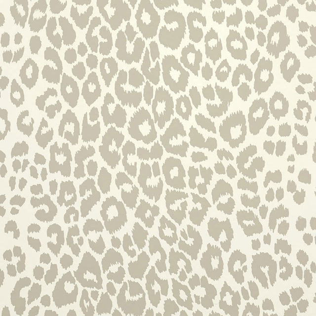 Iconic Leopard wallpaper in Linen by Schumacher, featuring a classic animal print pattern in neutral tones, shown in styled interior settings.