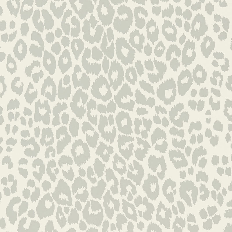 Iconic Leopard Cloud wallpaper by Schumacher shown in a modern interior and close-up of the animal print pattern.