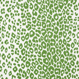 Iconic Leopard green animal print wallpaper by Schumacher, shown in a room setting and close-up detail.
