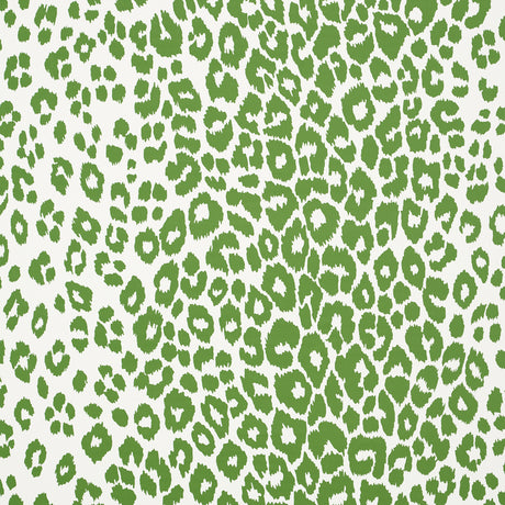 Iconic Leopard green animal print wallpaper by Schumacher, shown in a room setting and close-up detail.