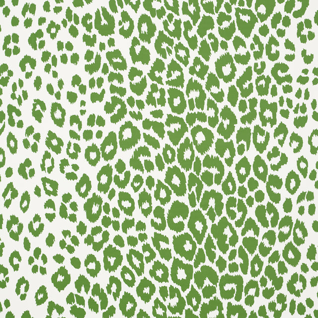 Iconic Leopard green animal print wallpaper by Schumacher, shown in a room setting and close-up detail.