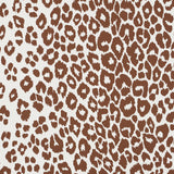 Brown and white leopard print wallpaper from Schumacher's Preppy Chic collection, shown in close-up and styled room settings.