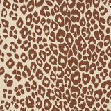 Iconic Leopard wallpaper in brown on neutral by Schumacher, featuring a bold animal print pattern.