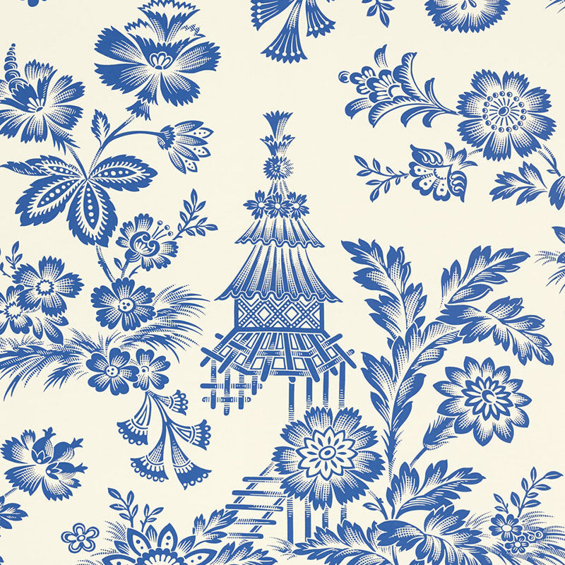 Blue and white Song Garden wallpaper with a graphic flower and pagoda pattern by Schumacher, shown in a bathroom setting.
