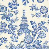 Blue and white Song Garden wallpaper with a graphic flower and pagoda pattern by Schumacher, shown in a bathroom setting.