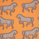 FAUBOURG wallpaper in orange by Schumacher featuring a bold, graphic horse pattern on a vibrant background, shown in a styled interior and close-up views.