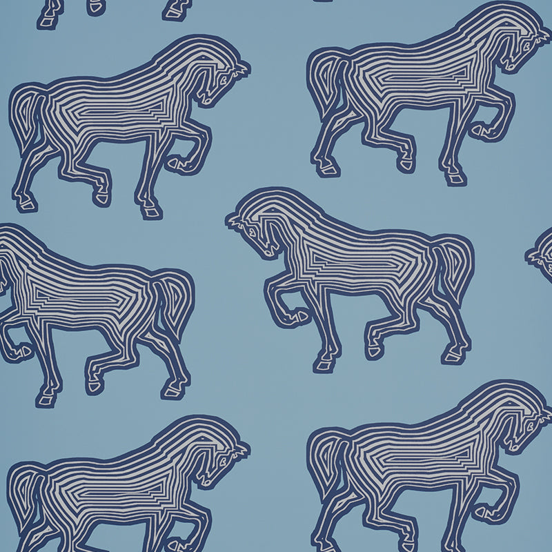 Blue wallpaper with a graphic equestrian horse pattern by Schumacher, FAUBOURG collection.