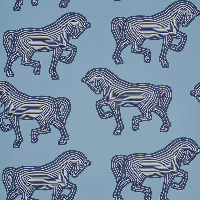 Blue wallpaper with a graphic equestrian horse pattern by Schumacher, FAUBOURG collection.
