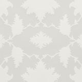 Garden of Persia Quartz wallpaper by Mary McDonald for Schumacher, large-scale Persian-inspired floral damask in white and soft grey, shown in a dining room setting.