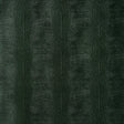 Komodo Forest Green embossed faux lizard wallpaper by Schumacher, shown in close-up and installed in a bathroom setting.