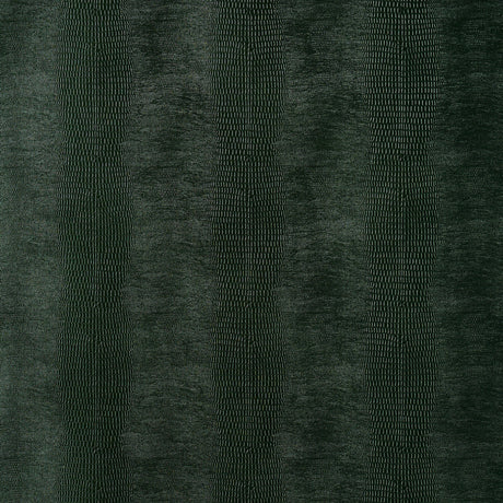 Komodo Forest Green embossed faux lizard wallpaper by Schumacher, shown in close-up and installed in a bathroom setting.