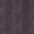 Komodo Sepia wallpaper by Schumacher features a luminous, embossed faux reptile pattern in a rich sepia tone.