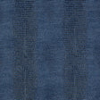 Komodo Prussian blue faux embossed wallpaper by Schumacher shown in a bathroom interior and close-up texture view.