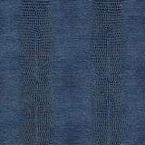 Komodo Prussian blue faux embossed wallpaper by Schumacher shown in a bathroom interior and close-up texture view.