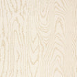 Faux Bois Sand Shimmer wallpaper by Schumacher shown in a stylized wood-grain pattern with a hint of iridescence, installed in a modern dining room.