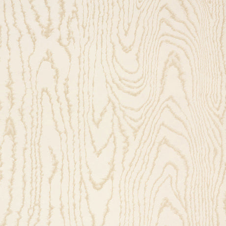 Faux Bois Sand Shimmer wallpaper by Schumacher shown in a stylized wood-grain pattern with a hint of iridescence, installed in a modern dining room.
