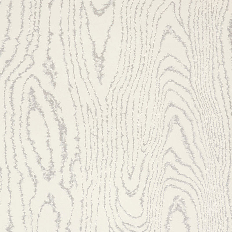Faux Bois Silver Moon wallpaper by Schumacher shown in a modern dining room and as a close-up of the wood grain pattern.