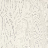 Faux Bois Silver Moon wallpaper by Schumacher shown in a modern dining room and as a close-up of the wood grain pattern.