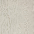Faux Bois Stone wallpaper by Schumacher shown in a stylized wood-grain pattern, installed in a modern dining room.