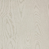 Faux Bois Stone wallpaper by Schumacher shown in a stylized wood-grain pattern, installed in a modern dining room.