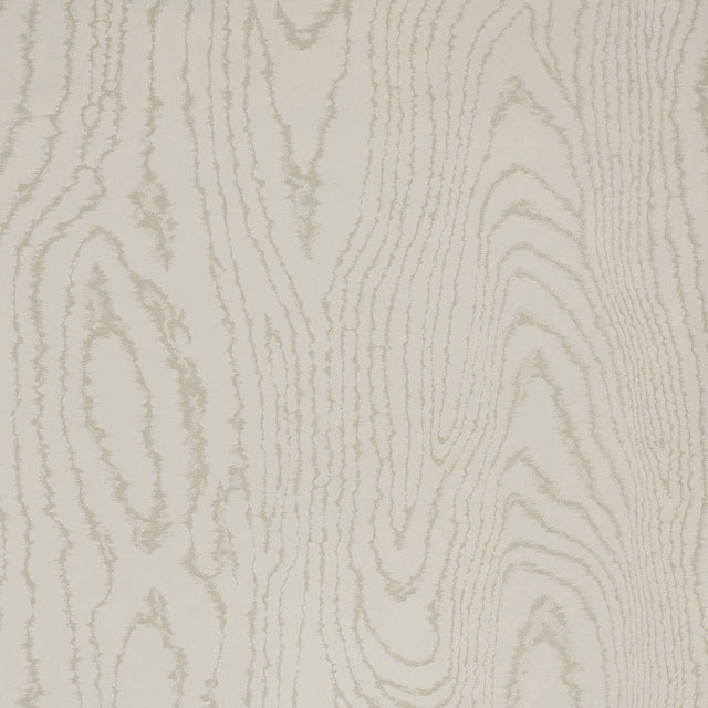 Faux Bois Stone wallpaper by Schumacher shown in a stylized wood-grain pattern, installed in a modern dining room.