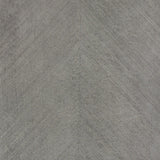 Combed Chevron Driftwood wallpaper by Schumacher in a chevron stripe pattern with a natural, organic wood-inspired texture.