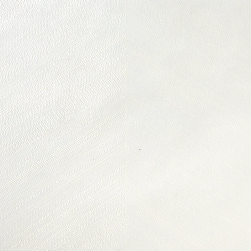 Combed Chevron Ivory textured chevron stripe wallpaper by Schumacher, shown in a styled interior and close-up detail.