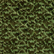Tortoise Amazon by Celerie Kemble for Schumacher. A green and brown tortoise shell patterned wallpaper shown in a styled interior and as a close-up.