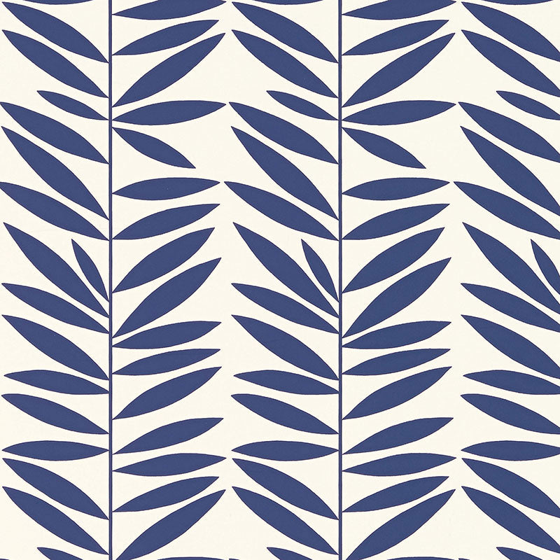 Leaf Stripe wallpaper in Marine by Schumacher, featuring a bold blue leaf pattern on a white background, shown in bedroom and bathroom settings.